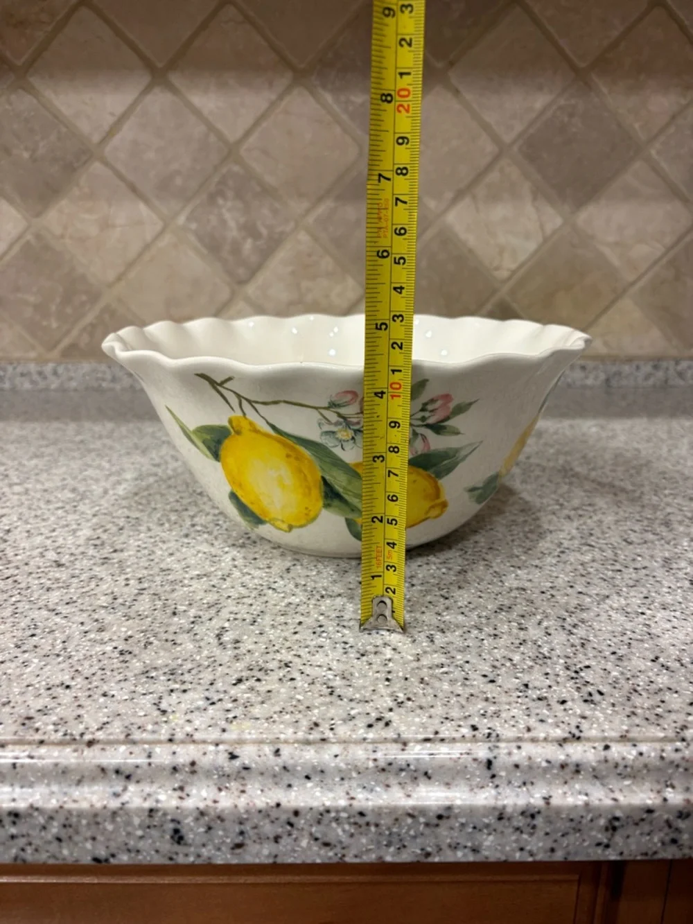 Hand-painted ceramic ruffle bowl featuring lemon motifs. Never Used. Display
